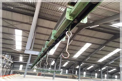 Overhead monorail green leaf handling system